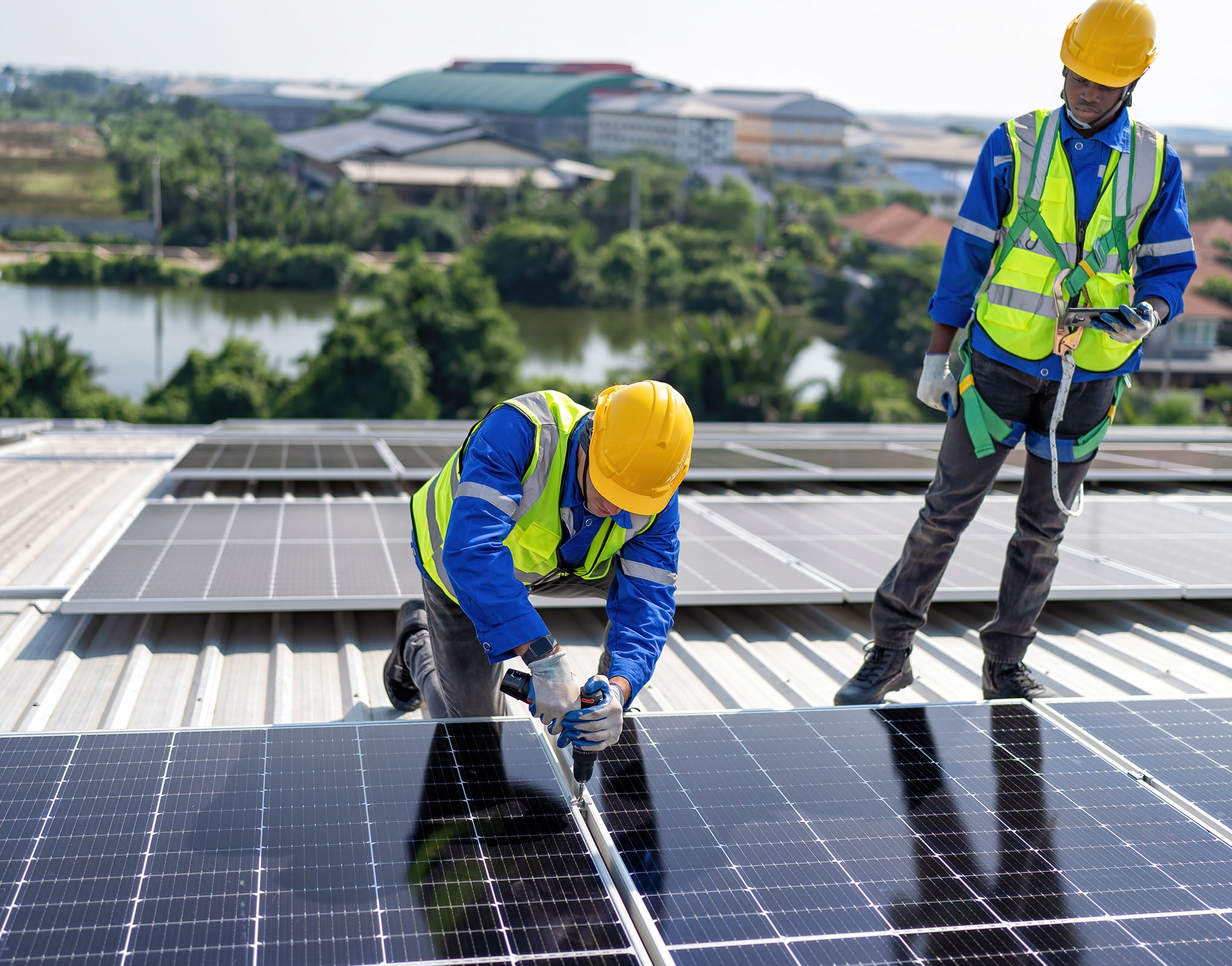 Screwing in Rooftop Solar Panels