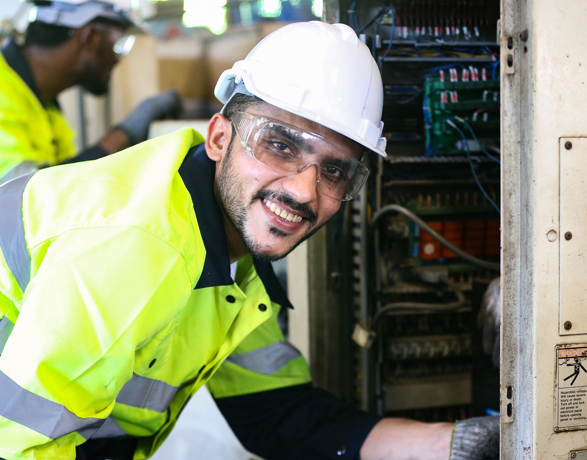 Industry Electrician Checking Solar Board at Factory