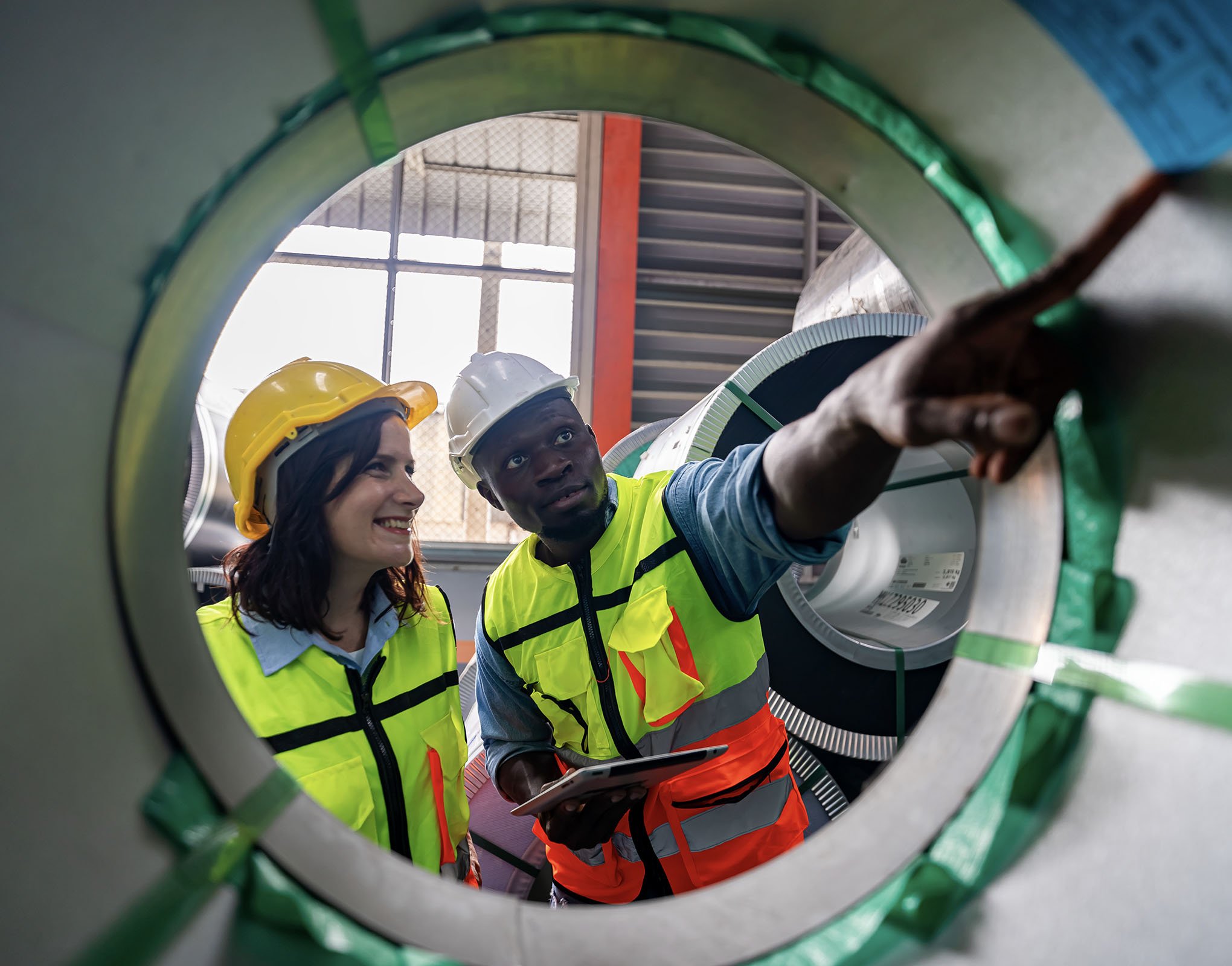 Industrial LCM Engineer inspecting the inside of a pipe