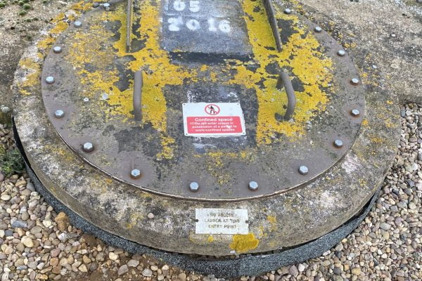 Man hole bolted shut Man hole bolted shut