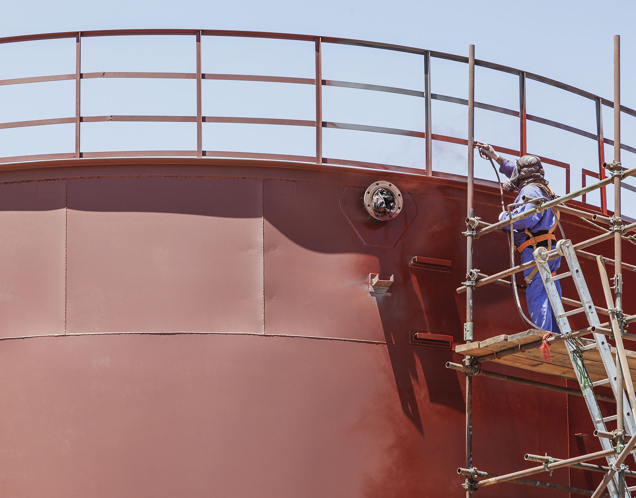 Large fuel tank being painted to protect it