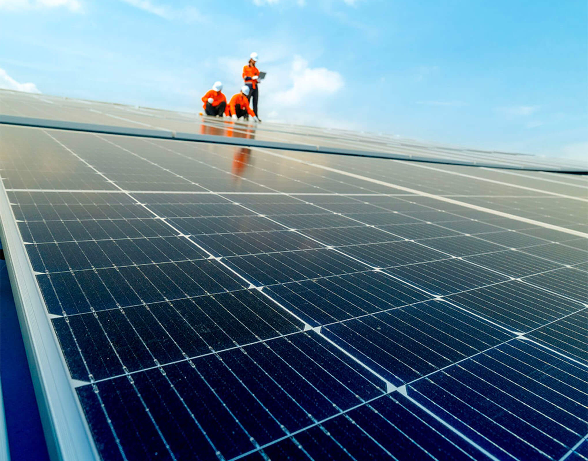 worker-on-solar-panels-resized Workers fitting solar panels